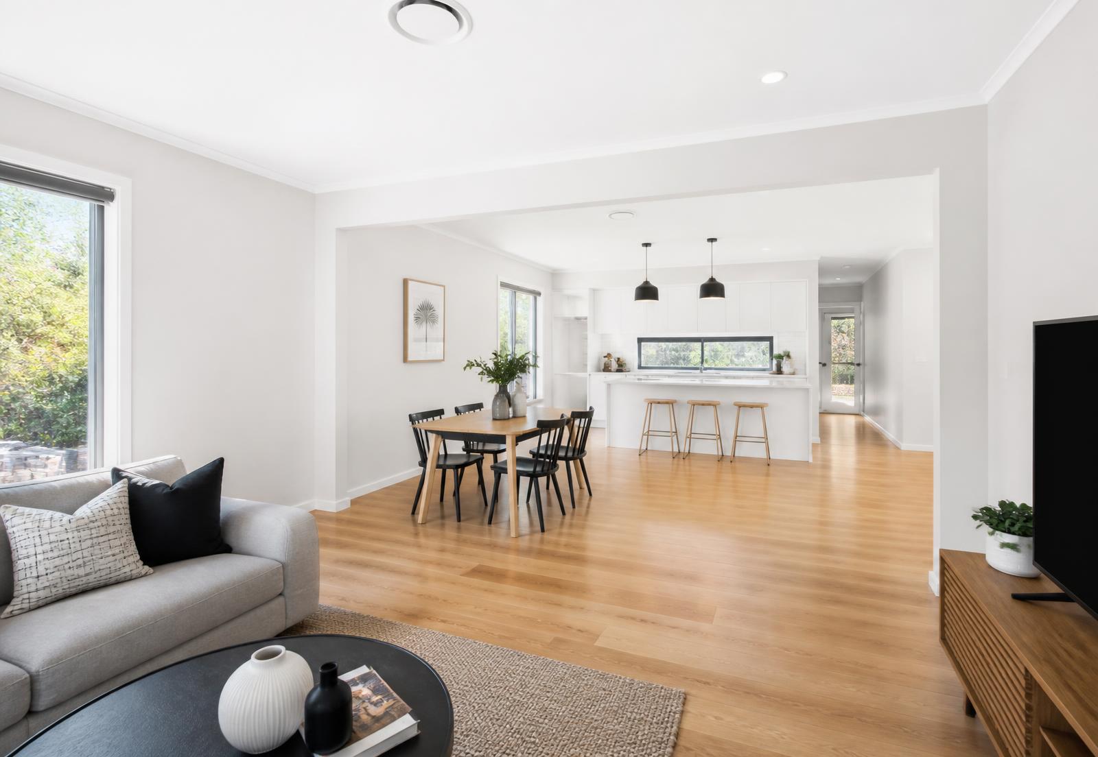 Freshly painted open-plan living and dining area in a bright Brisbane home